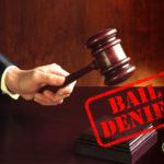 Judge striking gavel with "Bail Denied" caption