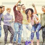 a group of people with an open containers on the street.